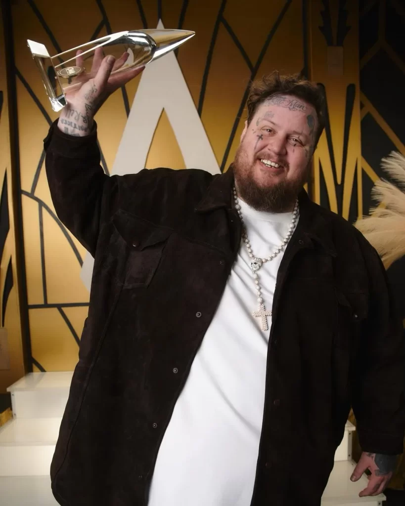 Jelly roll with CMA NEW ARTIST OF THE YEAR award