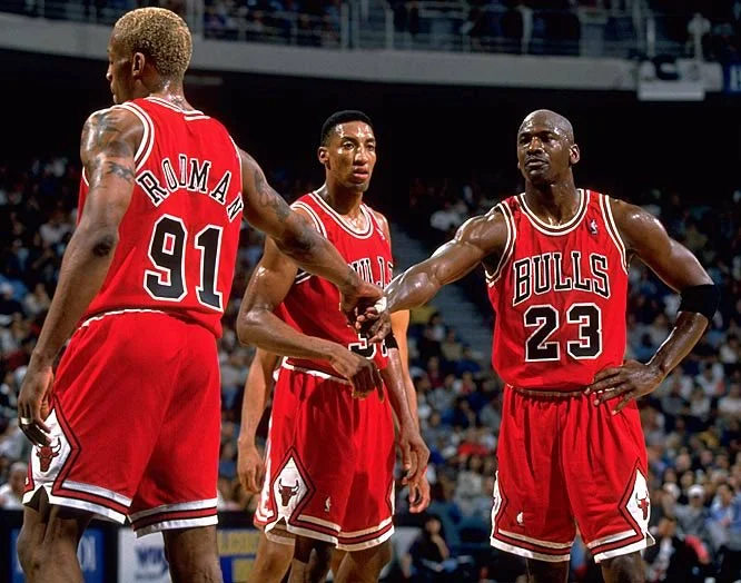 Dennis Rodman with Chicago Bulls team and Michael Jordan