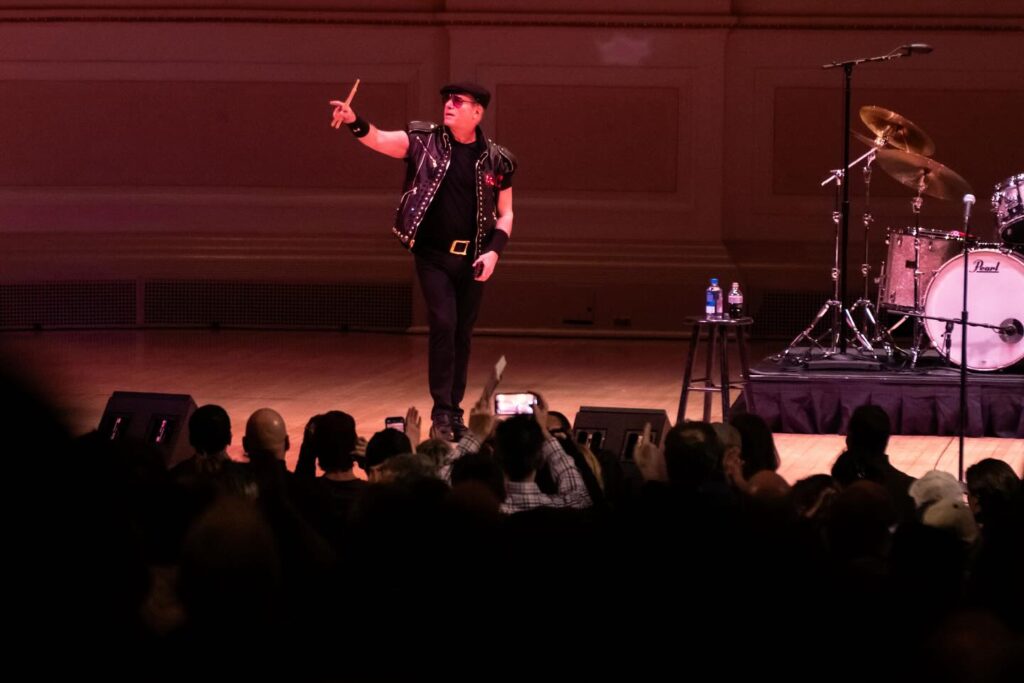 Andrew Dice Clay singing on stage