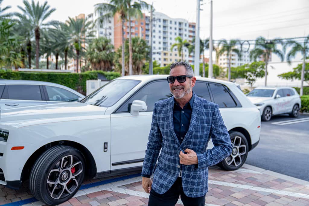 Grant Cardone with his car