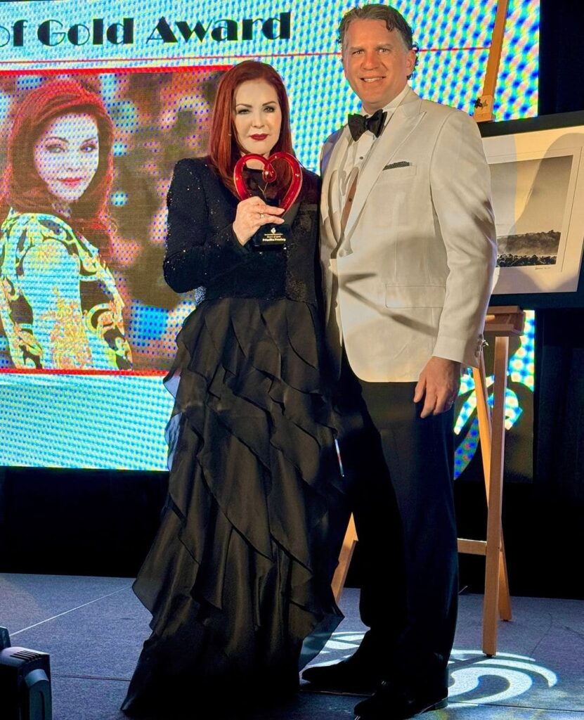 Priscilla Presley with award