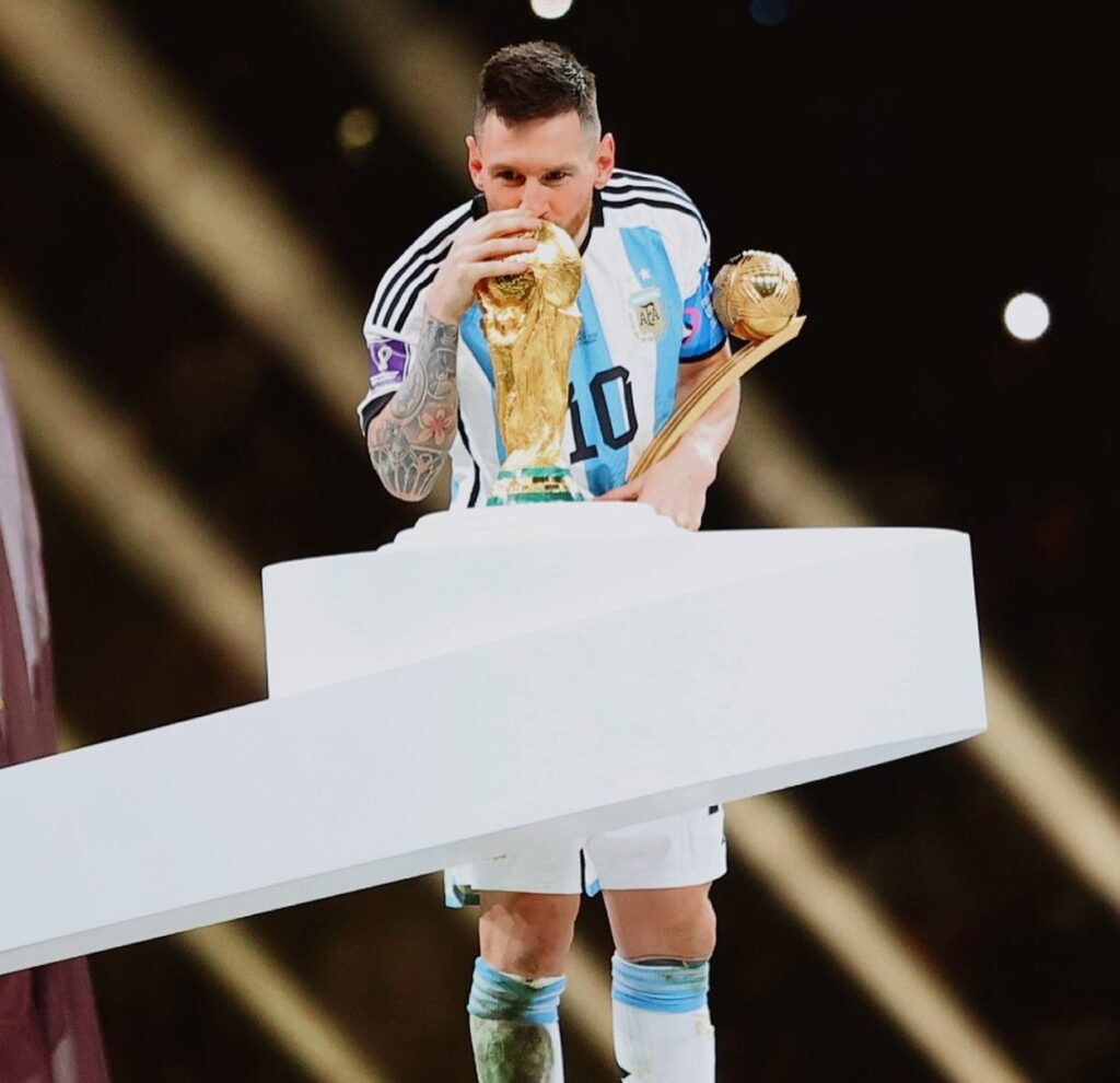 Messi with 2022 Fifa world cup after winning