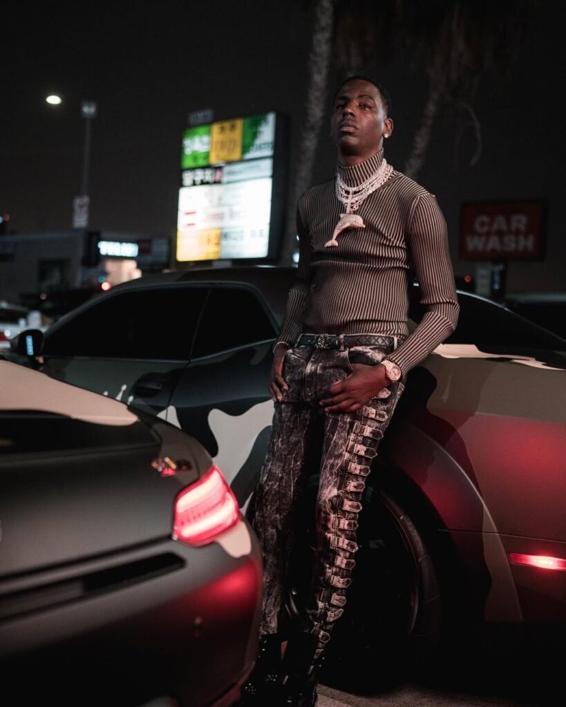 Rapper Young Dolph with huis car